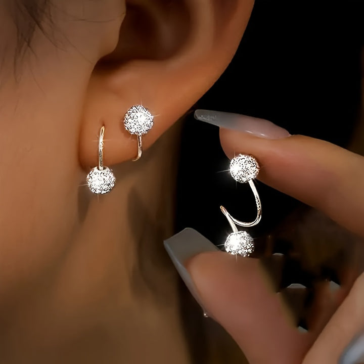 Spirale d’Éclat – Boucles d’oreilles à bille sertie